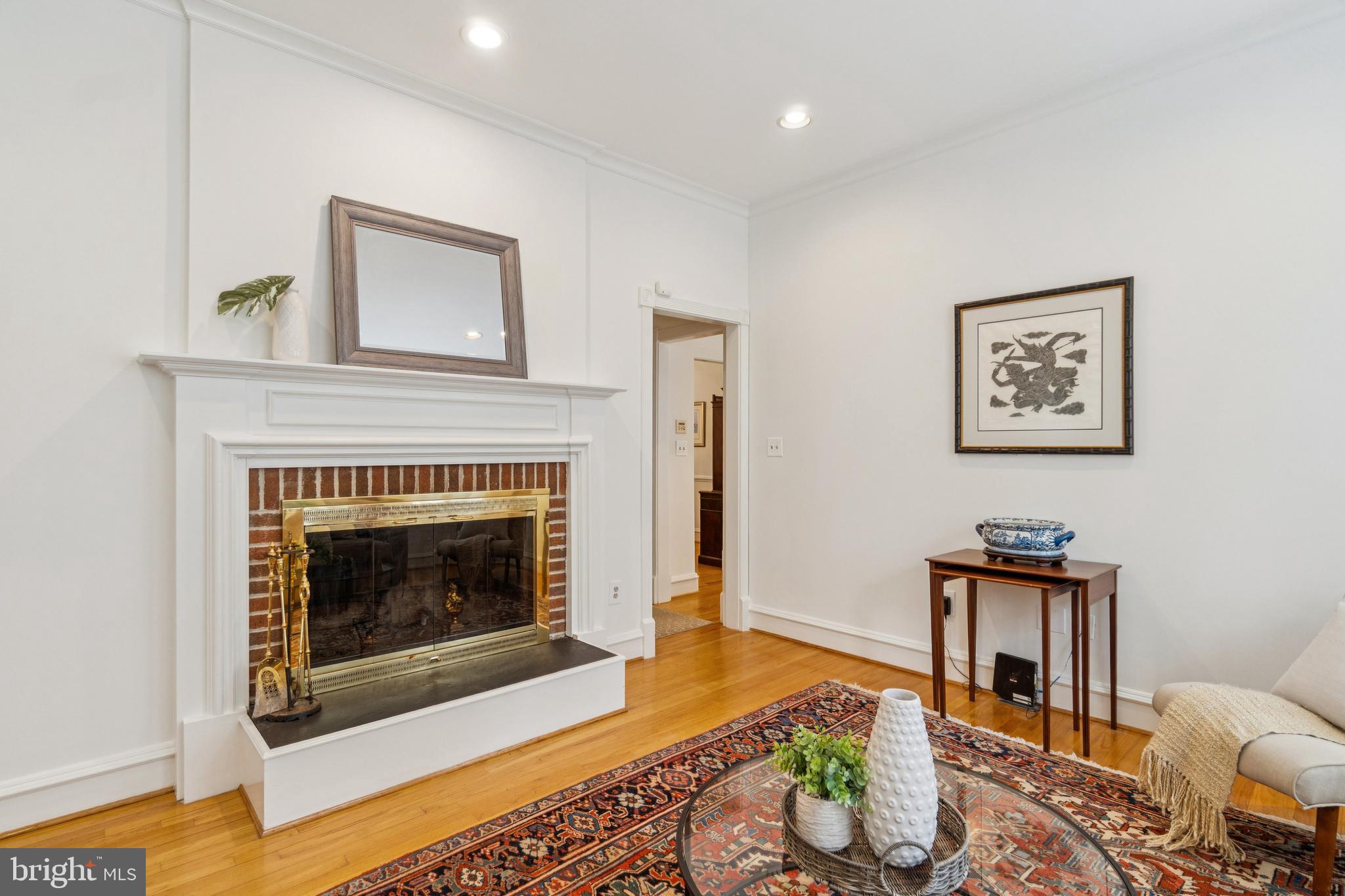 4406 Stanford Street Chevy Chase, MD 20815 - Photo 17 of 49 a living room with furniture and a fireplace