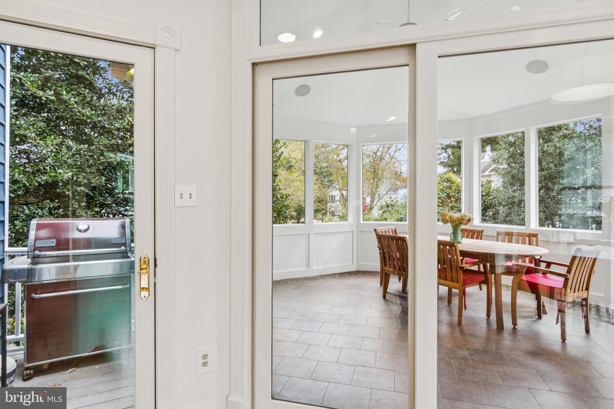 4406 Stanford Street Chevy Chase, MD 20815 - Photo 19 of 49 a view of a dining room with furniture a chandelier and wooden floor