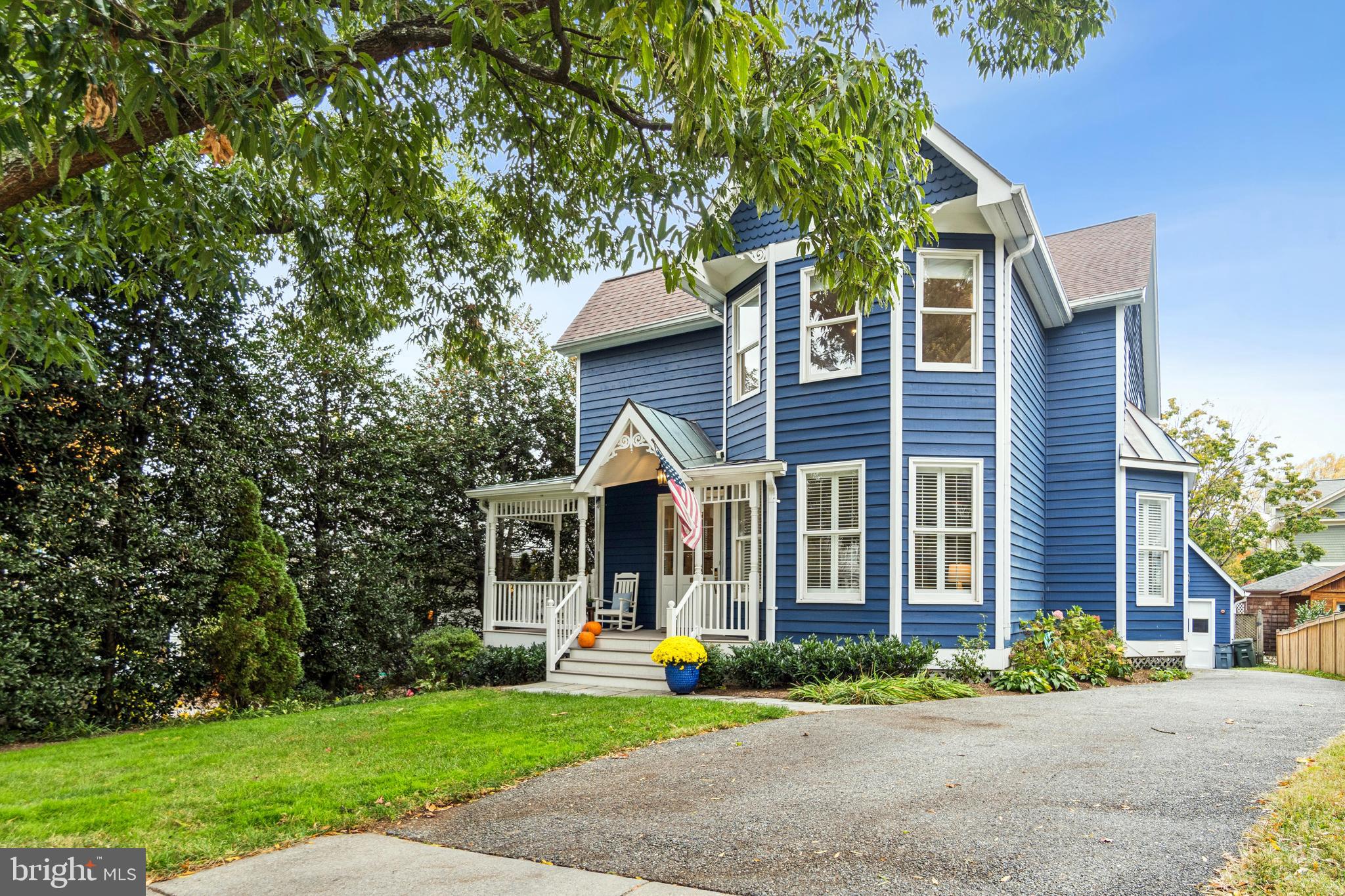 4406 Stanford Street Chevy Chase, MD 20815 - Photo 2 of 49 a view of a brick house with a yard plants and large tree