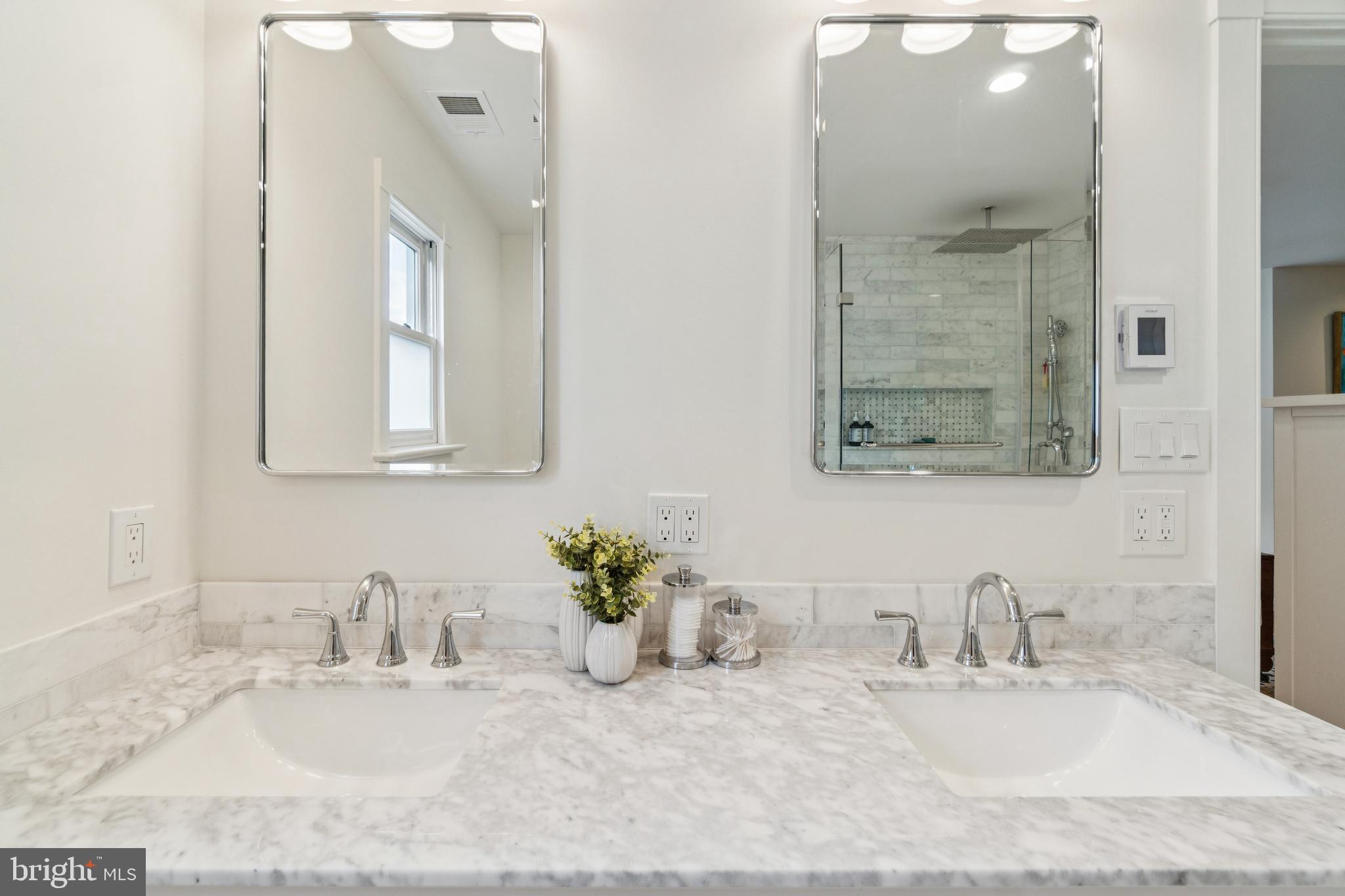 4406 Stanford Street Chevy Chase, MD 20815 - Photo 29 of 49 a bathroom with a granite countertop sink vanity and mirror