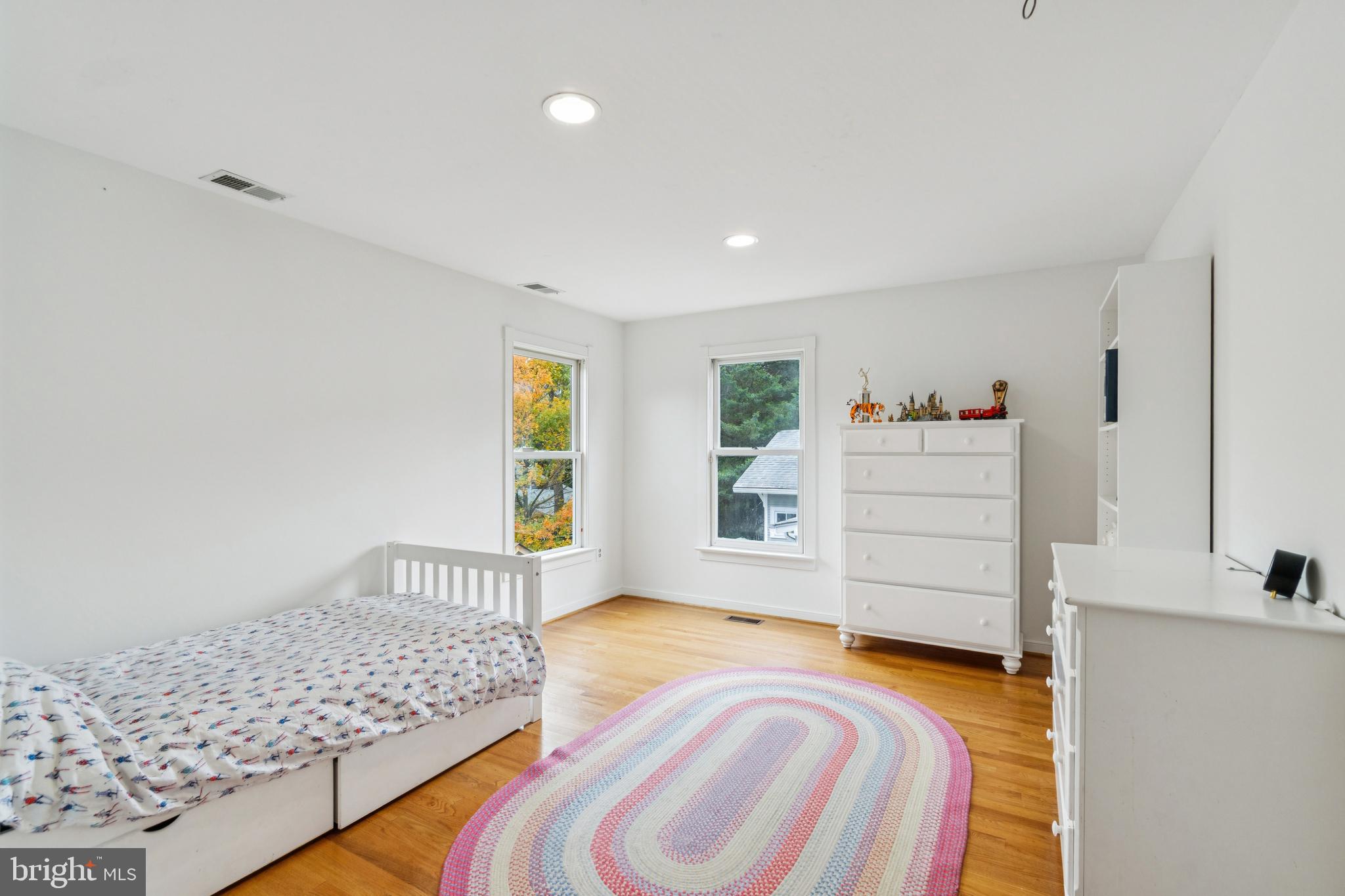 4406 Stanford Street Chevy Chase, MD 20815 - Photo 31 of 49 a bedroom with a bed and a window