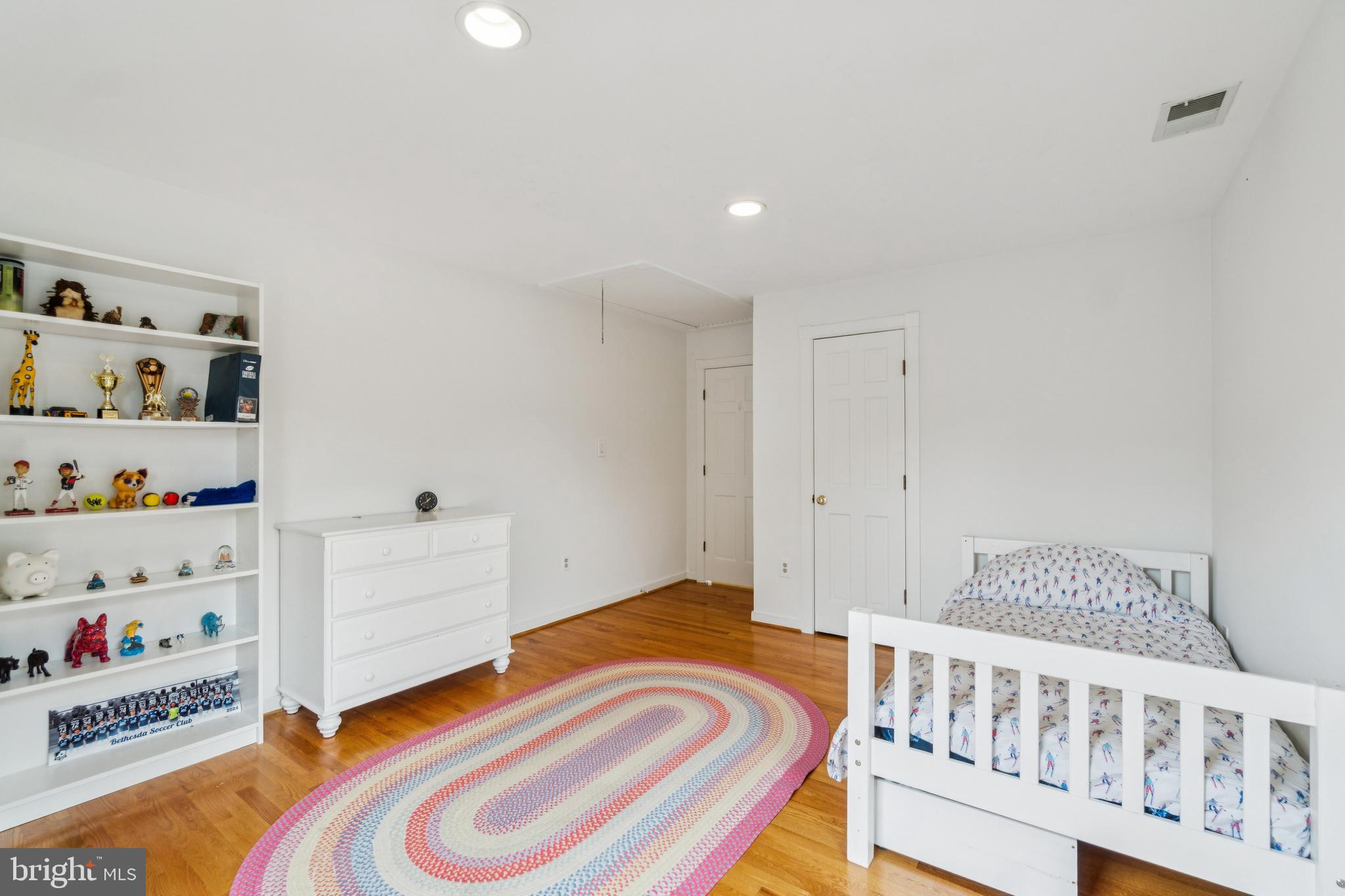 4406 Stanford Street Chevy Chase, MD 20815 - Photo 32 of 49 a bedroom with a bed and closet