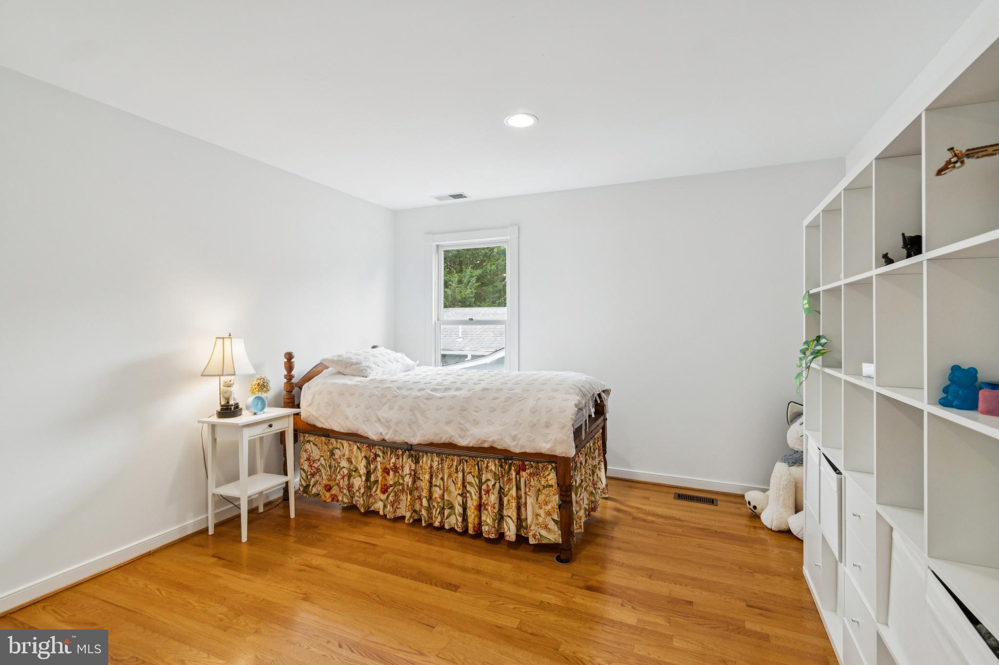 4406 Stanford Street Chevy Chase, MD 20815 - Photo 33 of 49 a bedroom with a bed and a chair