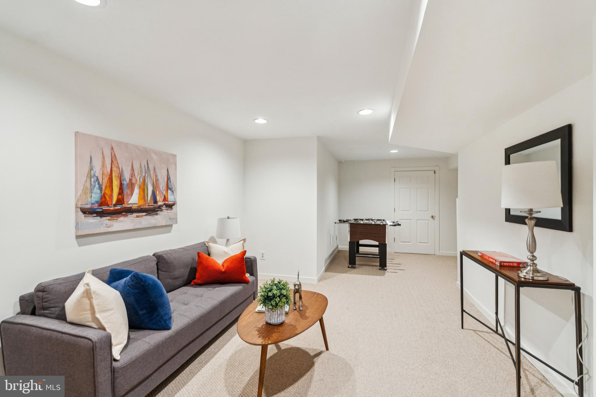 4406 Stanford Street Chevy Chase, MD 20815 - Photo 36 of 49 a living room with furniture and a flat screen tv