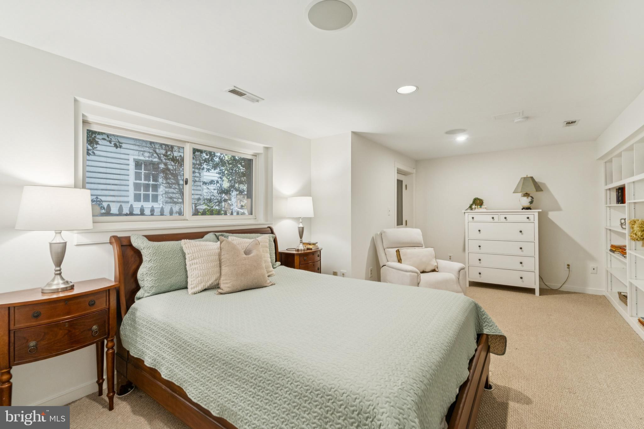 4406 Stanford Street Chevy Chase, MD 20815 - Photo 38 of 49 a bedroom with a bed and a large window