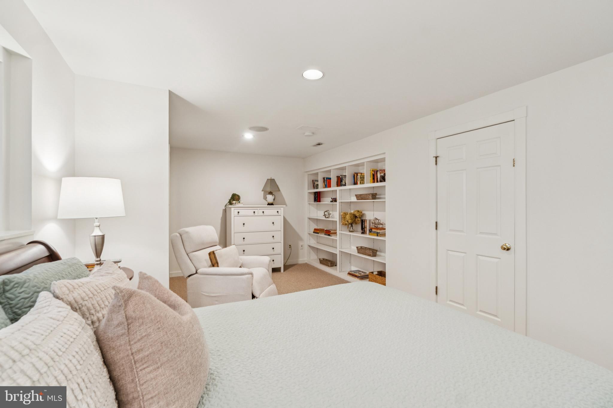 4406 Stanford Street Chevy Chase, MD 20815 - Photo 39 of 49 a bedroom with a bed and a lamp