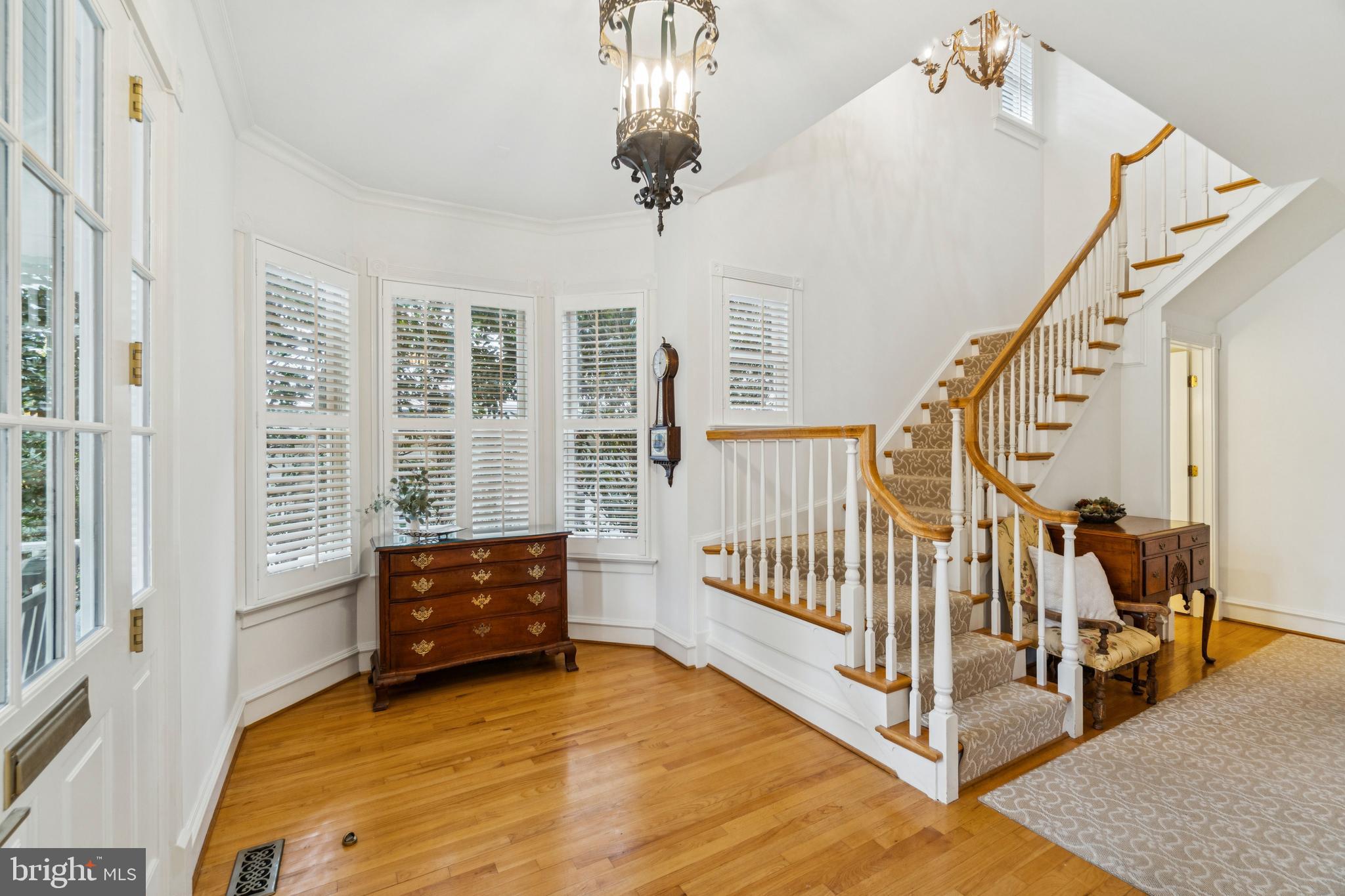 4406 Stanford Street Chevy Chase, MD 20815 - Photo 4 of 49 a living room with furniture and a chandelier