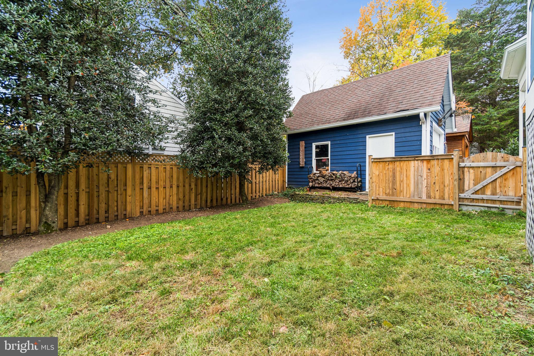 4406 Stanford Street Chevy Chase, MD 20815 - Photo 42 of 49 a view of a house with backyard and a garden