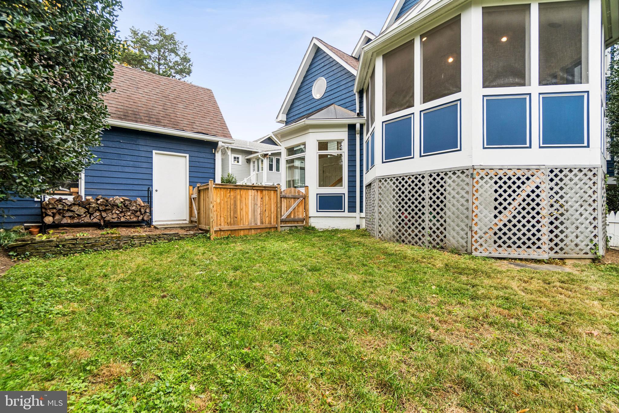 4406 Stanford Street Chevy Chase, MD 20815 - Photo 43 of 49 a front view of a house with a garden