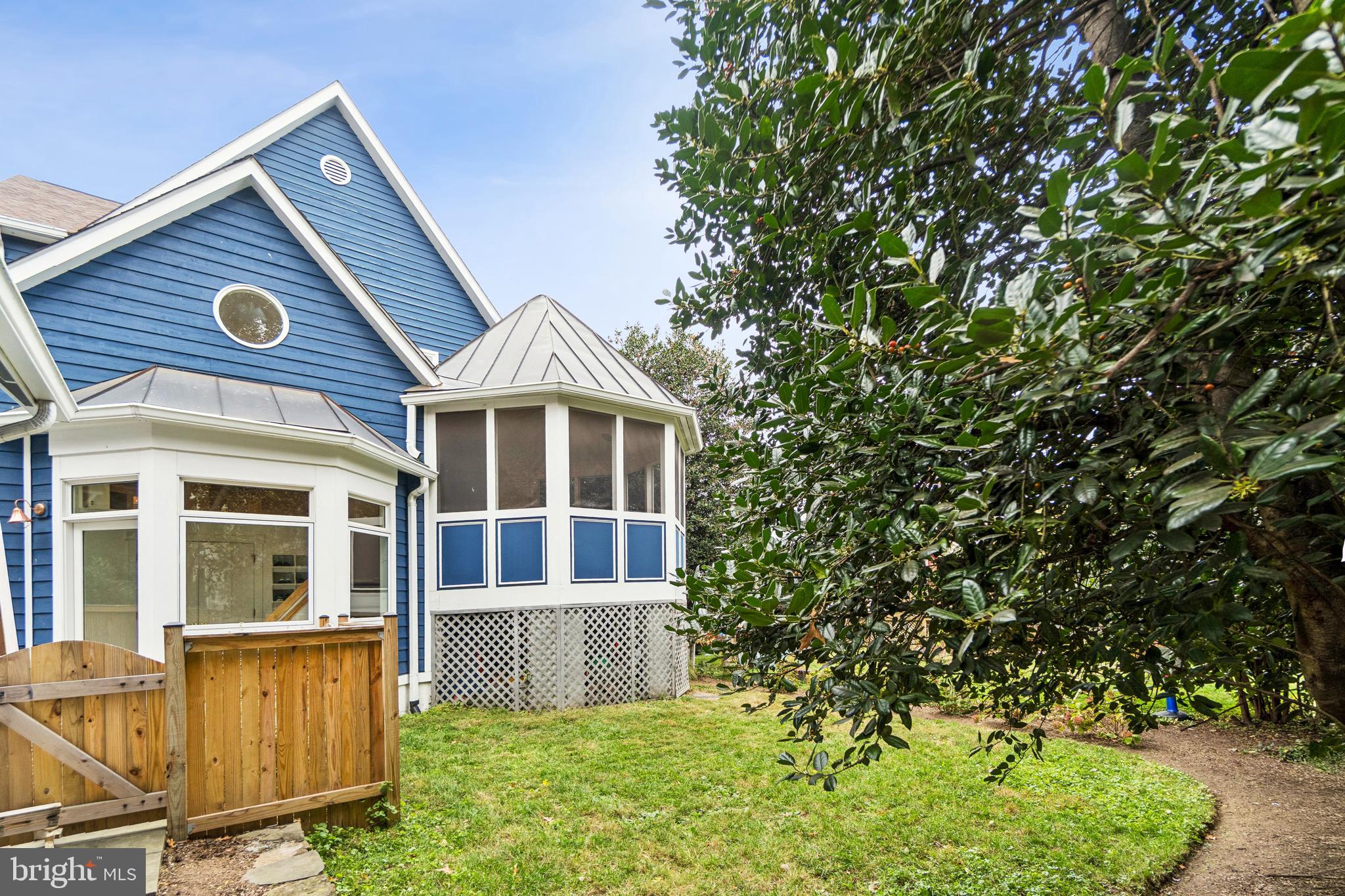 4406 Stanford Street Chevy Chase, MD 20815 - Photo 44 of 49 a front view of a house with a garden