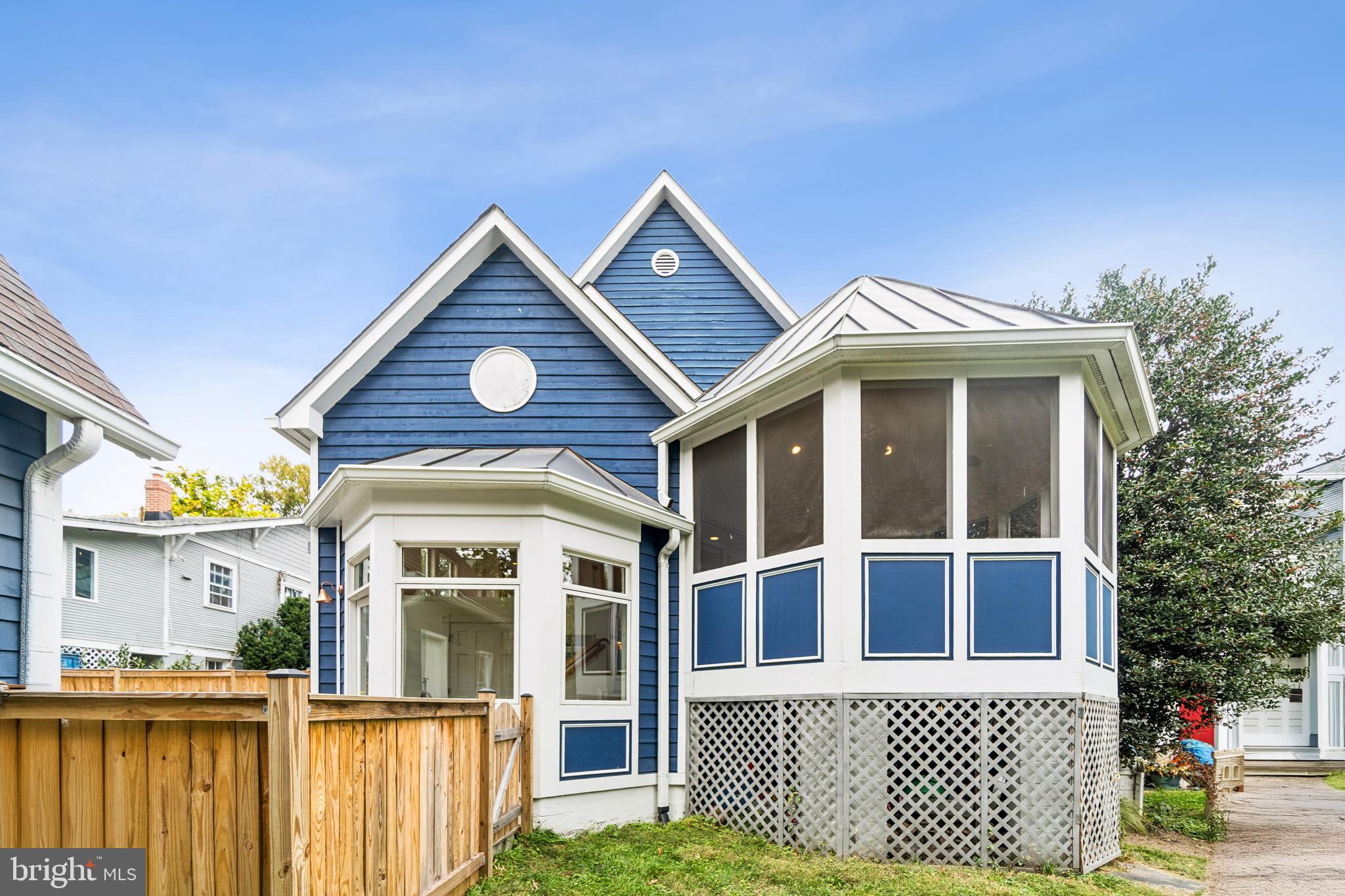 4406 Stanford Street Chevy Chase, MD 20815 - Photo 45 of 49 a front view of a house with a yard
