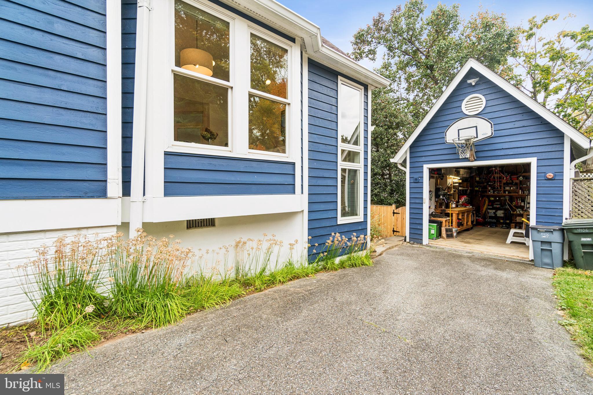4406 Stanford Street Chevy Chase, MD 20815 - Photo 47 of 49 a view of a house with a yard and garage