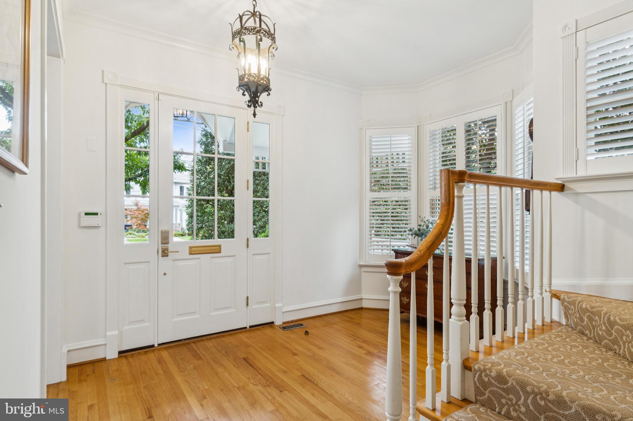 4406 Stanford Street Chevy Chase, MD 20815 - Photo 5 of 49 a view of an entryway with wooden floor and door
