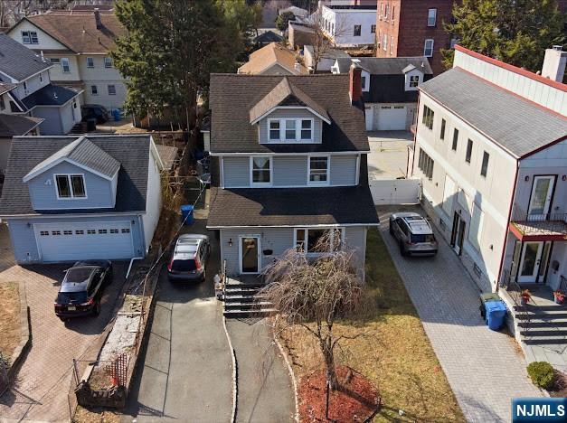 an aerial view of a house with a porch