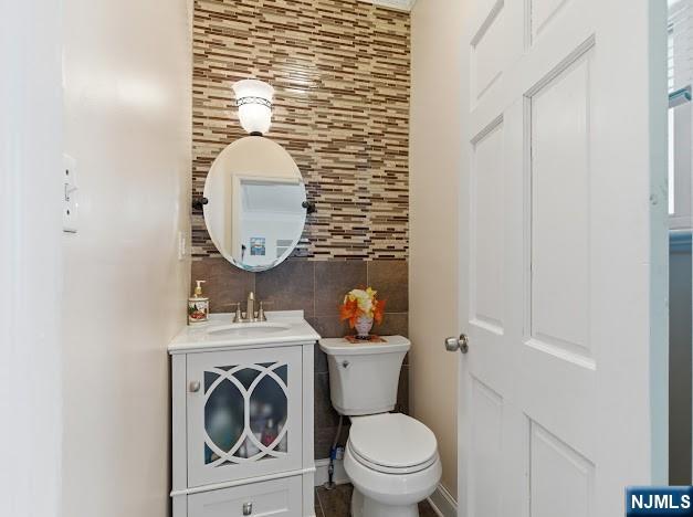 166 Summit Cross Rutherford, NJ 07070 - Photo 12 of 49 a bathroom with a toilet a sink and a mirror