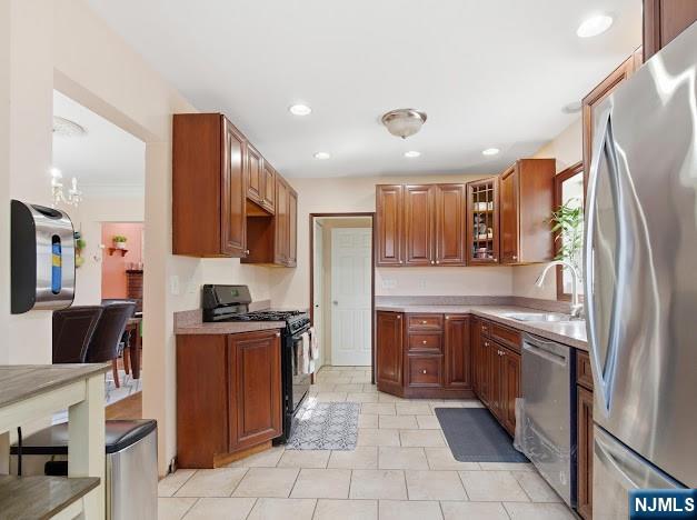 166 Summit Cross Rutherford, NJ 07070 - Photo 13 of 49 a kitchen with stainless steel appliances granite countertop a refrigerator stove top oven and sink