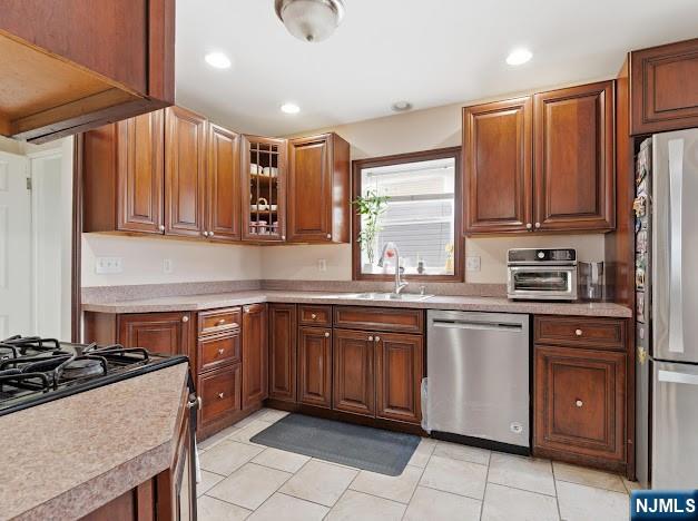 166 Summit Cross Rutherford, NJ 07070 - Photo 14 of 49 a kitchen with stainless steel appliances granite countertop a stove a sink and a refrigerator