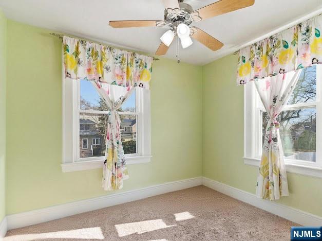 166 Summit Cross Rutherford, NJ 07070 - Photo 24 of 49 a view of a door with wooden floor and windows