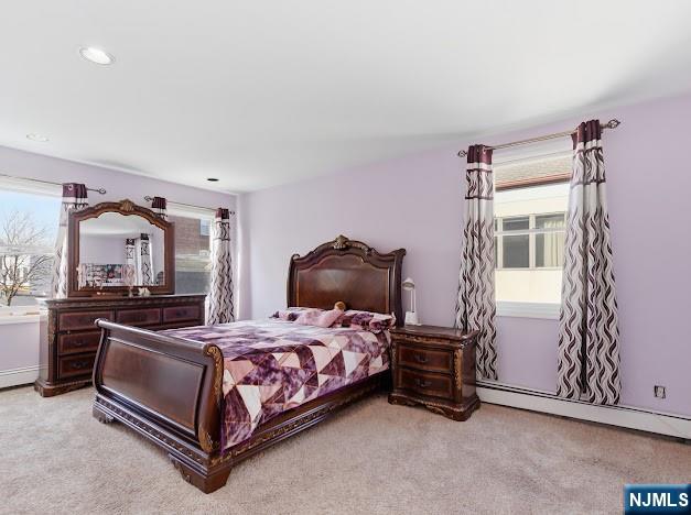 166 Summit Cross Rutherford, NJ 07070 - Photo 27 of 49 a bedroom with a bed and a chair