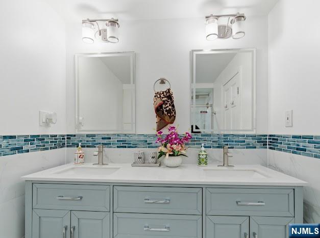 166 Summit Cross Rutherford, NJ 07070 - Photo 32 of 49 a bathroom with a sink and a mirror