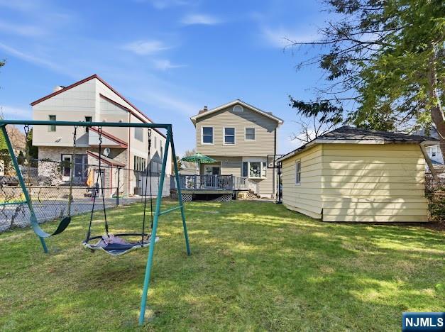 166 Summit Cross Rutherford, NJ 07070 - Photo 38 of 49 a view of a house with a yard and a table and chairs
