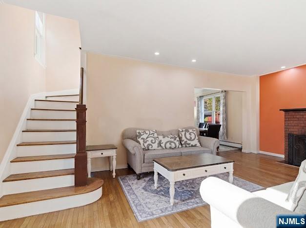 166 Summit Cross Rutherford, NJ 07070 - Photo 4 of 49 a living room with furniture and a wooden floor