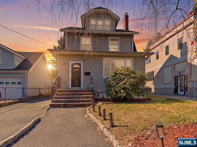 166 Summit Cross Rutherford, NJ 07070 - Photo 42 of 49 a front view of a house with a yard