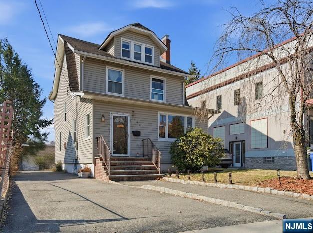 166 Summit Cross Rutherford, NJ 07070 - Photo 48 of 49 a front view of a house with a yard
