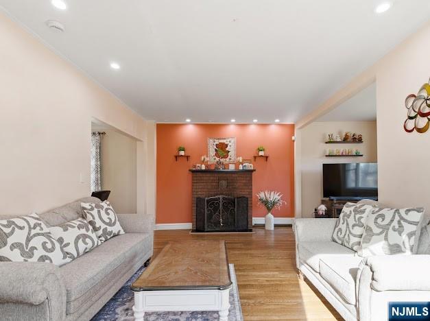 166 Summit Cross Rutherford, NJ 07070 - Photo 5 of 49 a living room with furniture a fireplace and a flat screen tv