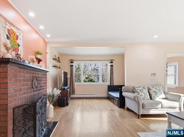 166 Summit Cross Rutherford, NJ 07070 - Photo 9 of 49 a living room with furniture large window and a flat screen tv