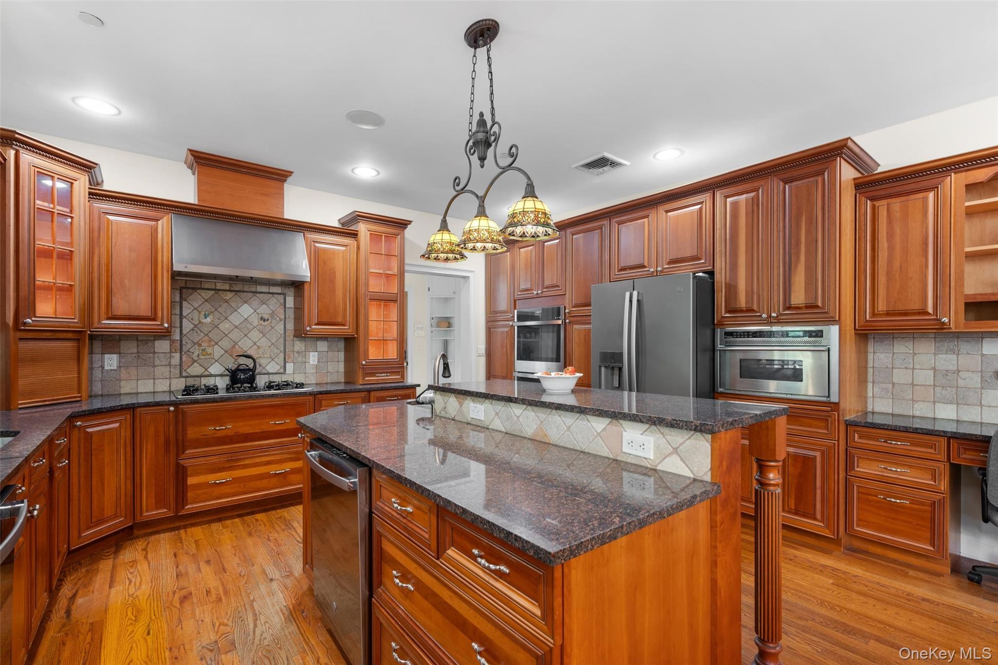 7 Farm Hollow Road Cornwall, NY 12553 - Photo 13 of 45 Notice the tiled backsplash and built in work area. Don't forget the pull out pantry!