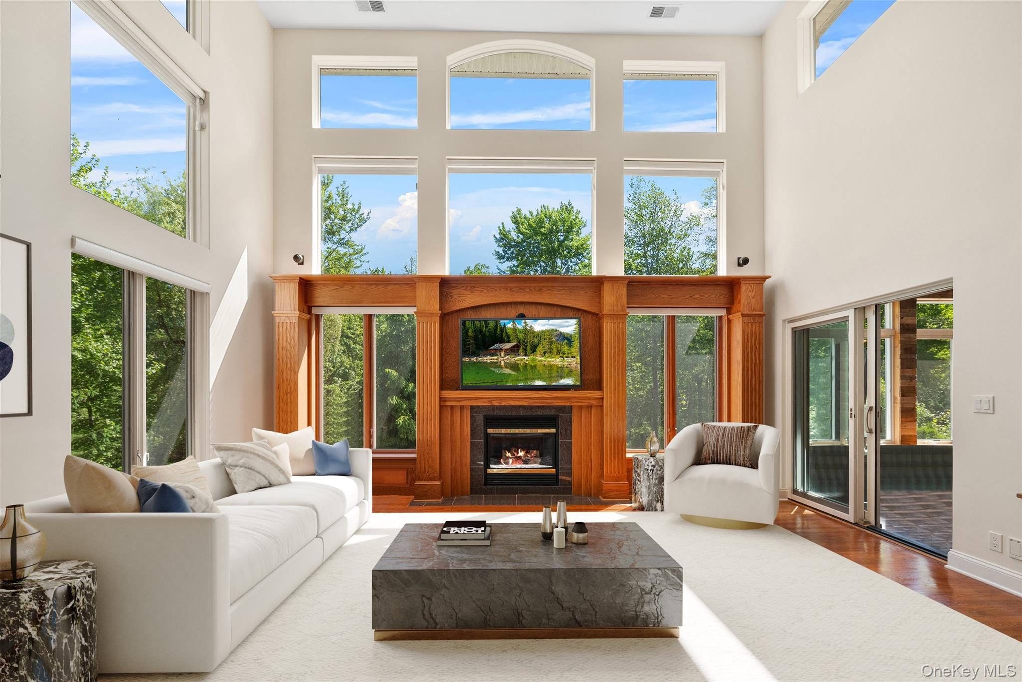 7 Farm Hollow Road Cornwall, NY 12553 - Photo 8 of 45 The gorgeous inlaid hardwood floors shimmer with natural light from the wall of windows.