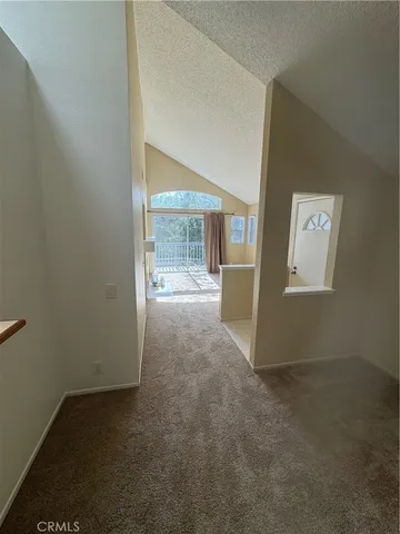 an empty room with entrance door