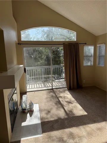 a view of a livingroom with furniture and front door