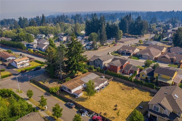 an aerial view of a house with a garden
