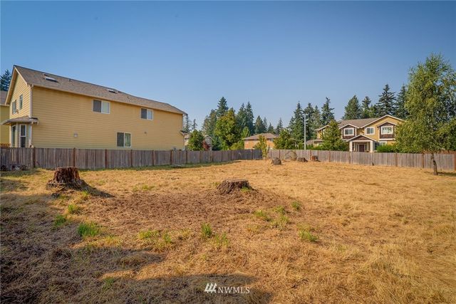 a view of a backyard of the house