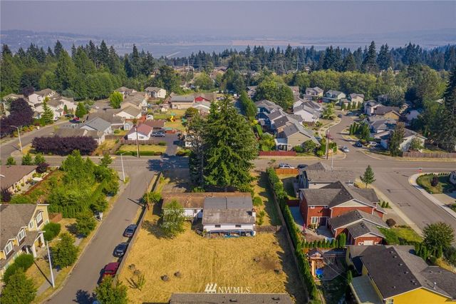 an aerial view of a houses with outdoor space