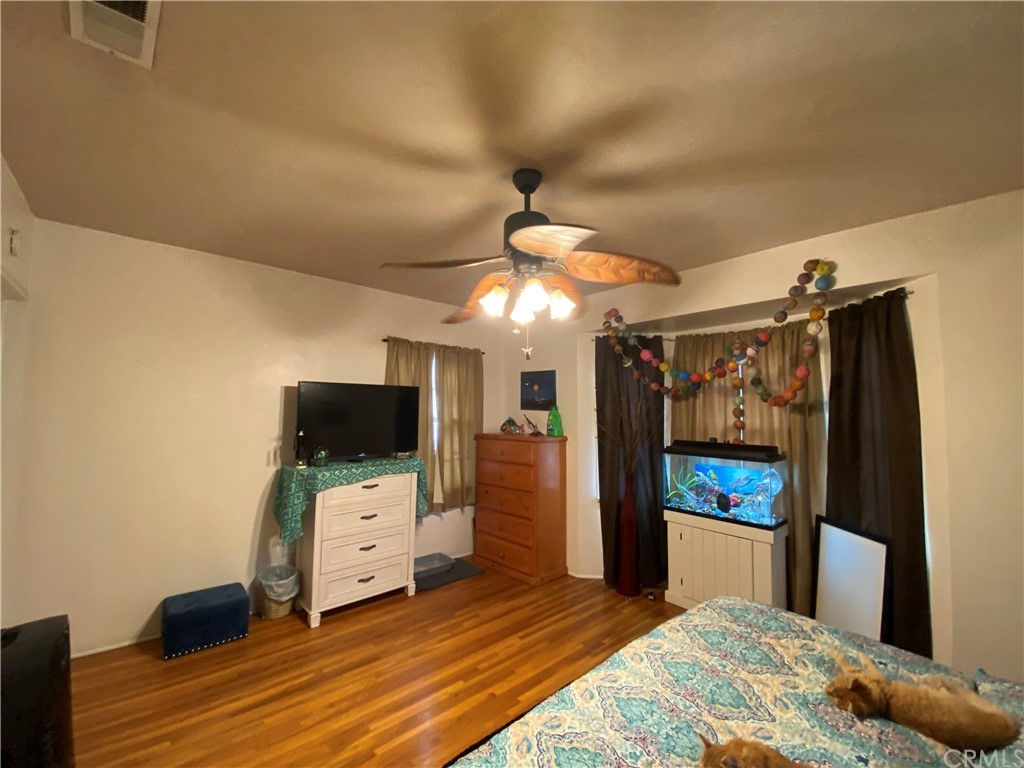 130 Pacific Street Bakersfield, CA 93305 - Photo 11 of 25 a view of a livingroom with furniture and a flat screen tv