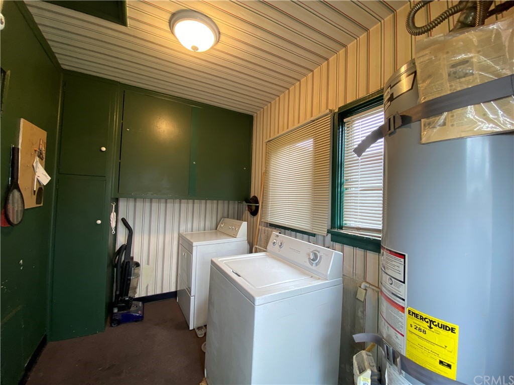 130 Pacific Street Bakersfield, CA 93305 - Photo 16 of 25 a bathroom with a sink a mirror and a shower