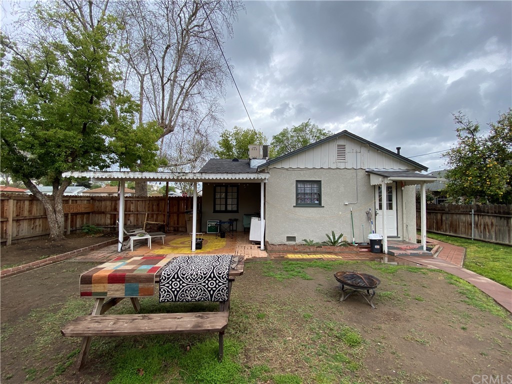 130 Pacific Street Bakersfield, CA 93305 - Photo 18 of 25 a backyard of a house with fire pit and outdoor seating