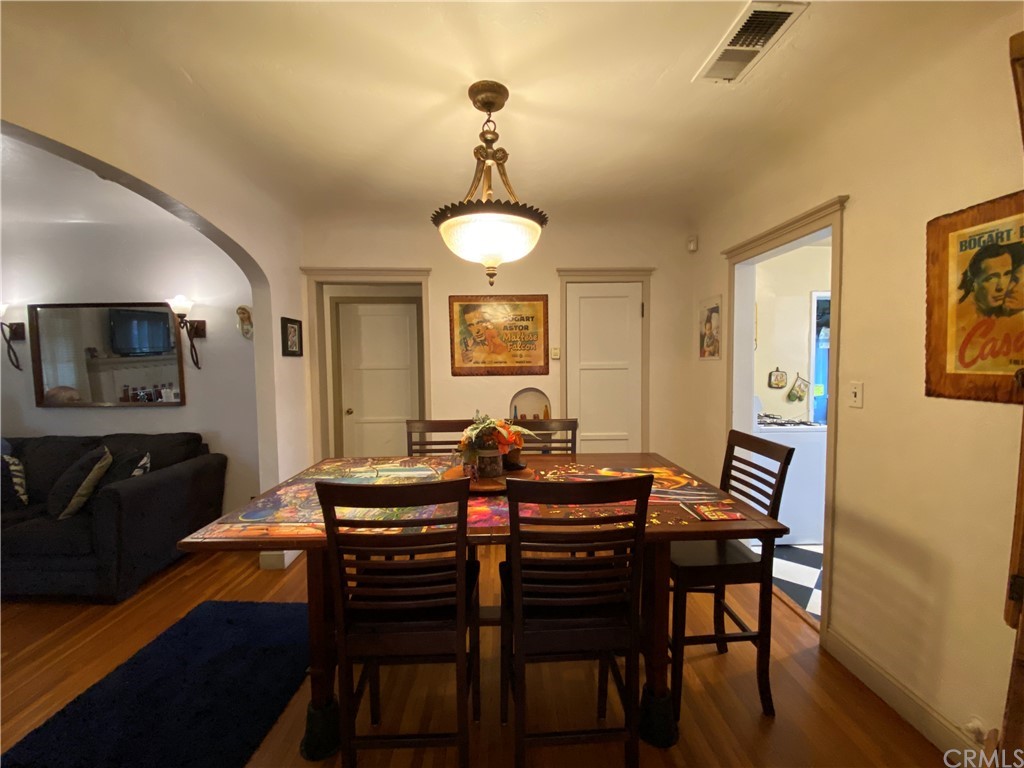 130 Pacific Street Bakersfield, CA 93305 - Photo 5 of 25 a view of a dining room with furniture and wooden floor