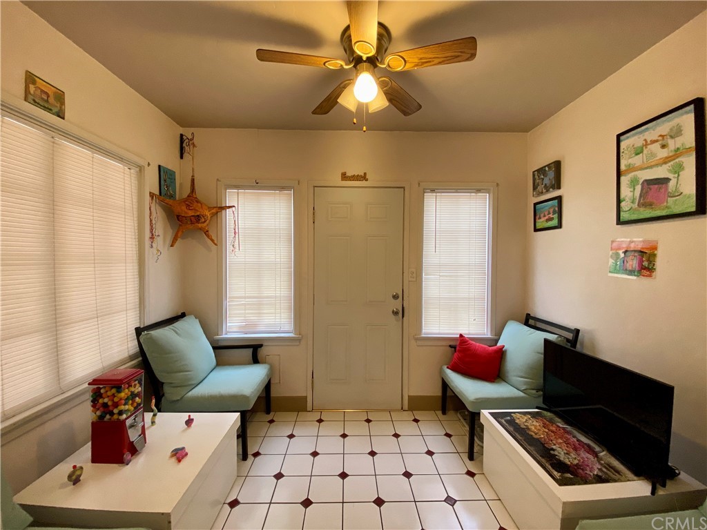 130 Pacific Street Bakersfield, CA 93305 - Photo 6 of 25 a bedroom with furniture and a window