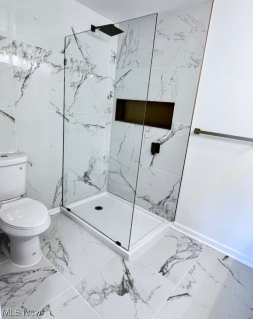 305 Tremont Road Akron, OH 44313 - Photo 22 of 25 Bathroom featuring tile floors, toilet, tile walls, and walk in shower
