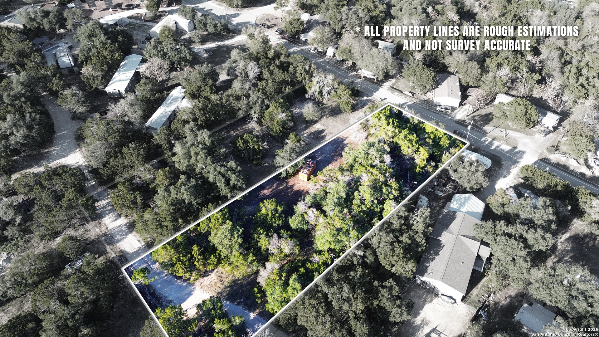 4527 Chamberlain Way Canyon Lake, TX 78133 - Photo 18 of 22 an aerial view of a residential houses with yard