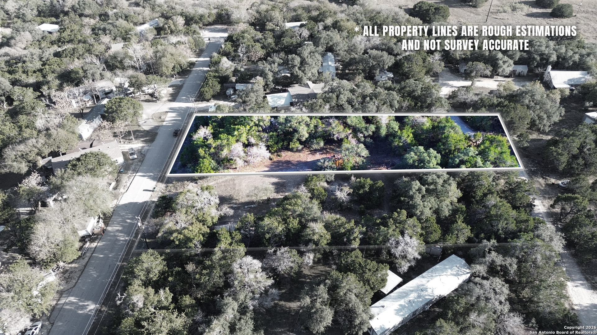 4527 Chamberlain Way Canyon Lake, TX 78133 - Photo 20 of 22 an aerial view of house with yard