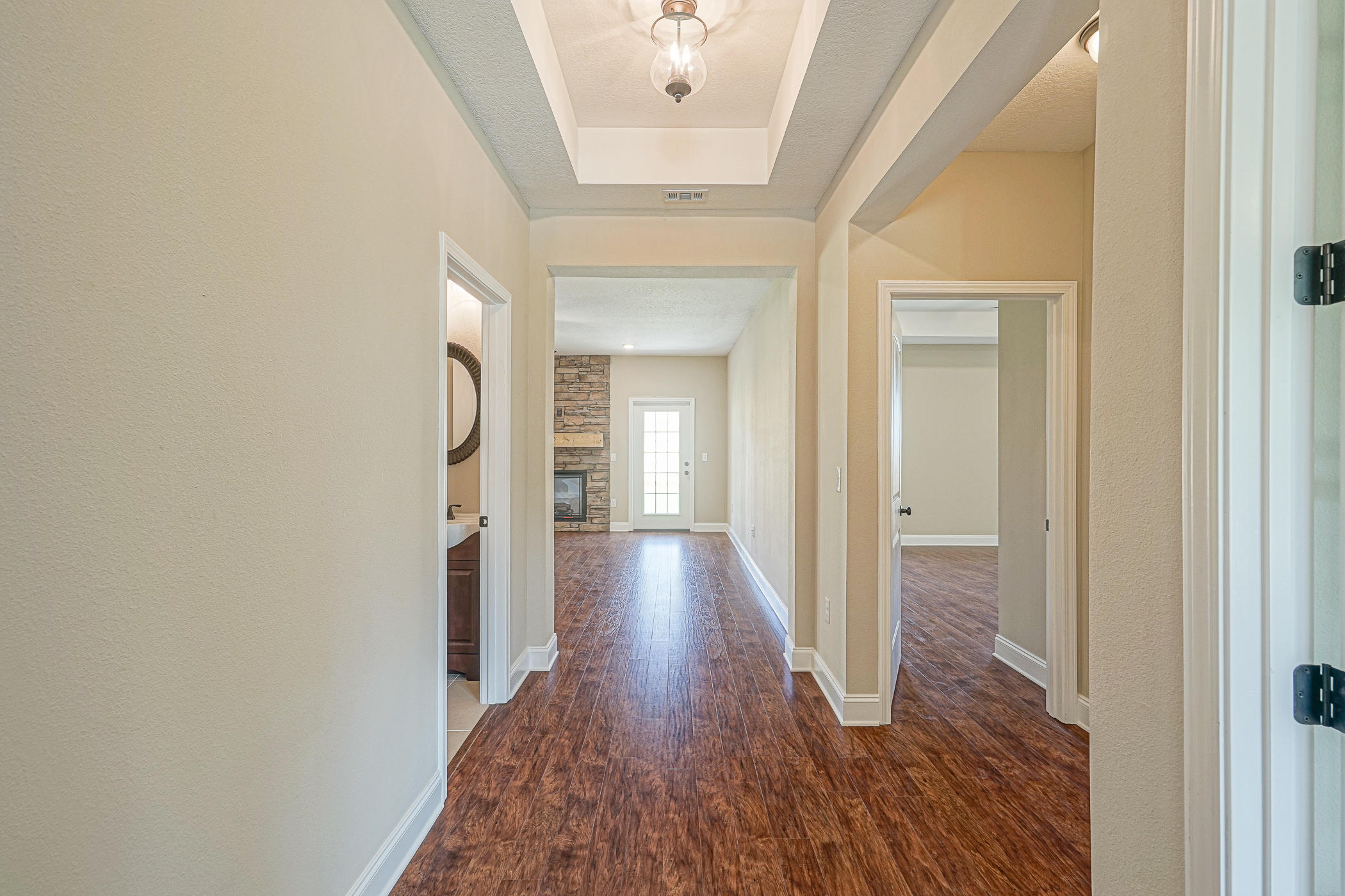 6193 Timberland Ridge Drive Crestview, FL 32539 - Photo 11 of 37 a view of a hallway with wooden floor