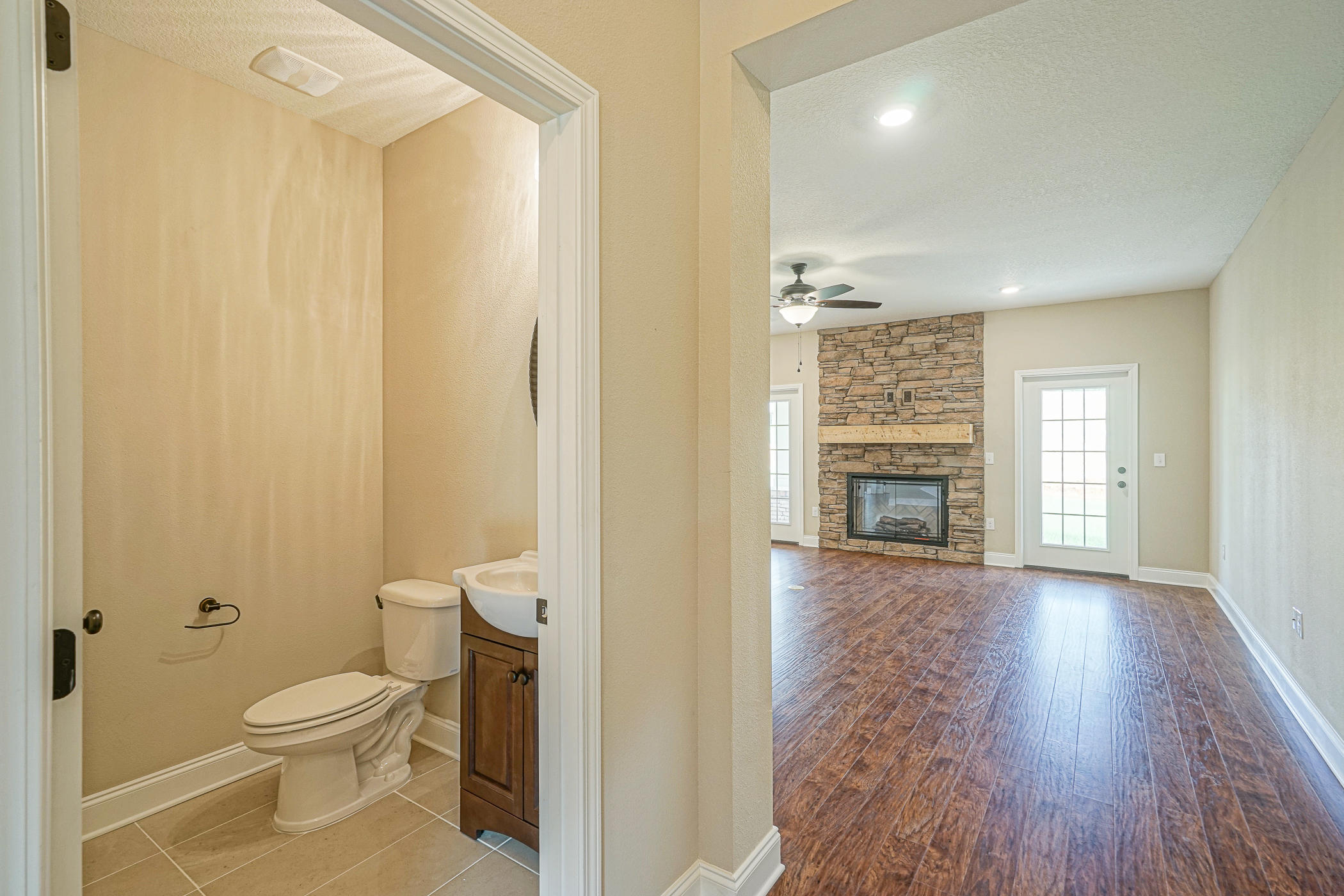 6193 Timberland Ridge Drive Crestview, FL 32539 - Photo 12 of 37 a bathroom with a granite countertop toilet a sink and a mirror