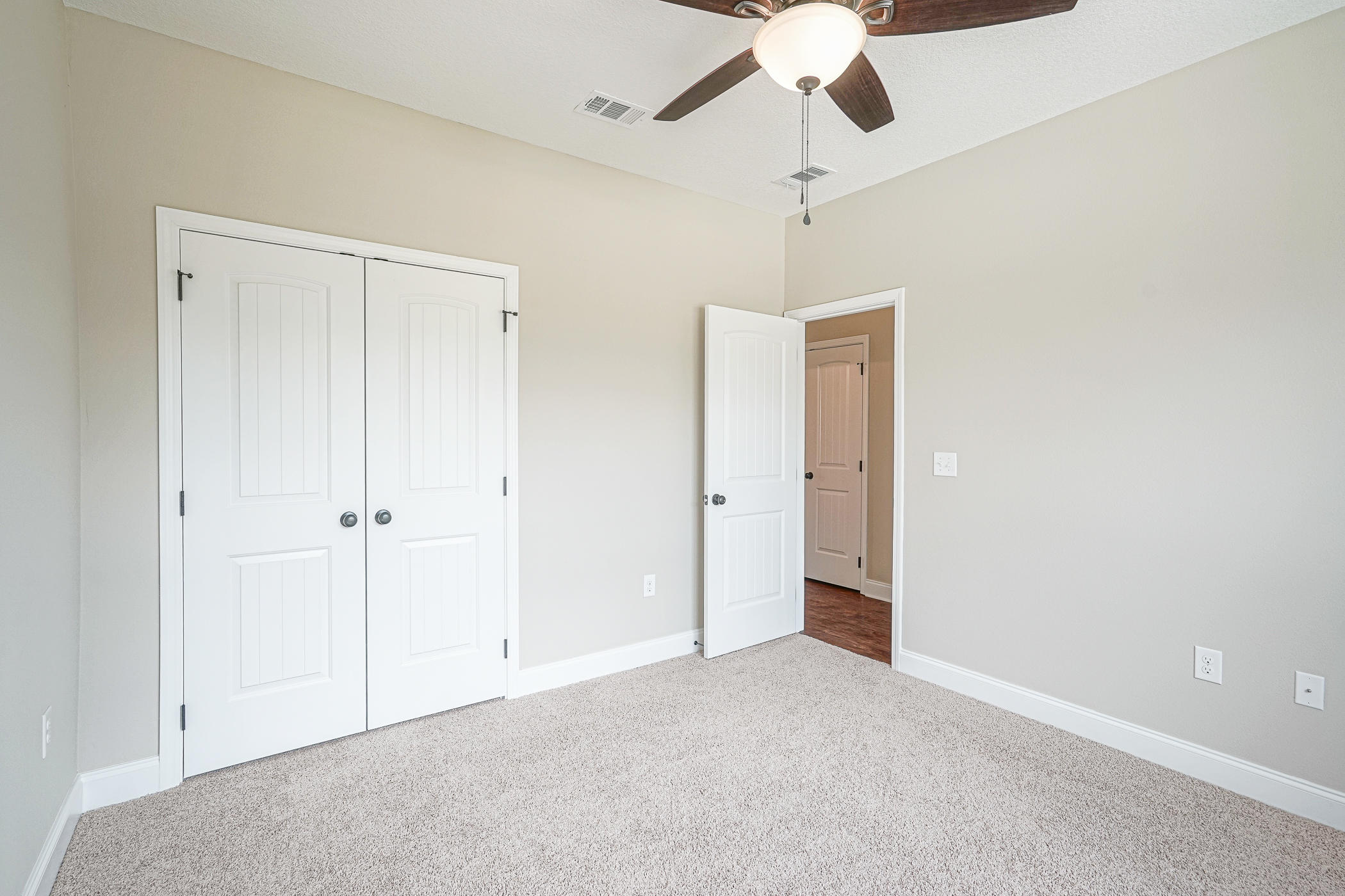 6193 Timberland Ridge Drive Crestview, FL 32539 - Photo 29 of 37 a view of an empty room and chandelier fan