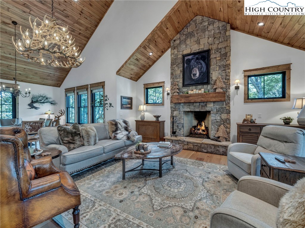 137 Green Cliffs Road Sugar Mountain, NC 28604 - Photo 11 of 48 a living room with furniture and a fireplace