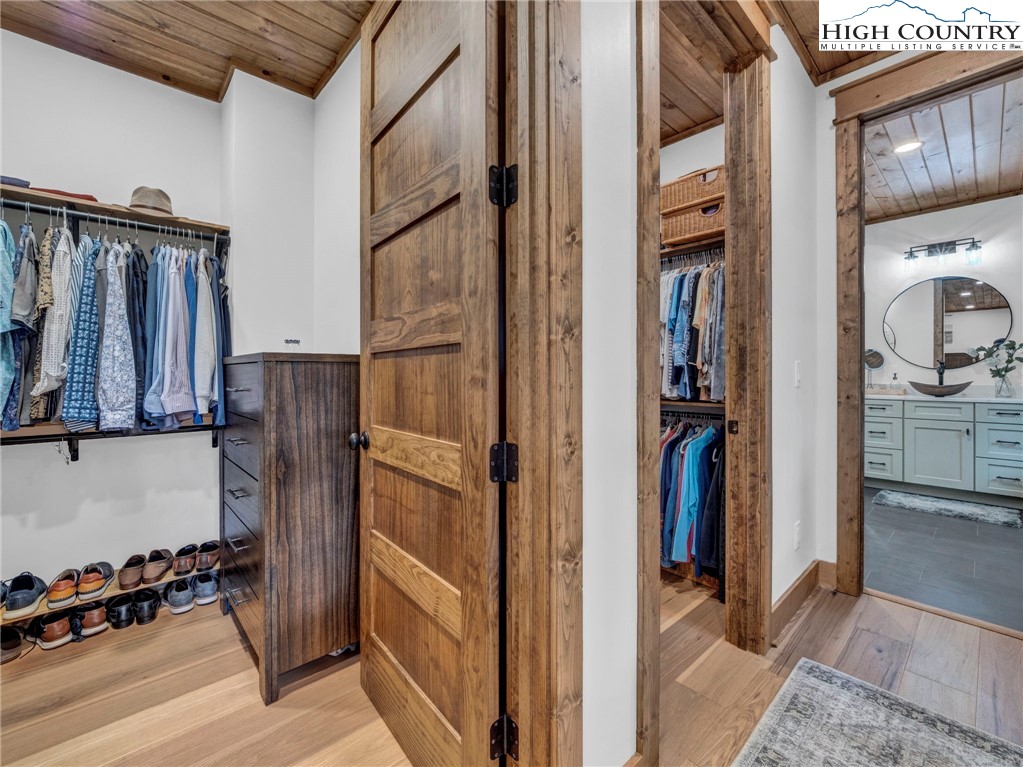 137 Green Cliffs Road Sugar Mountain, NC 28604 - Photo 23 of 48 a view of walk in closet with clothes and shoes